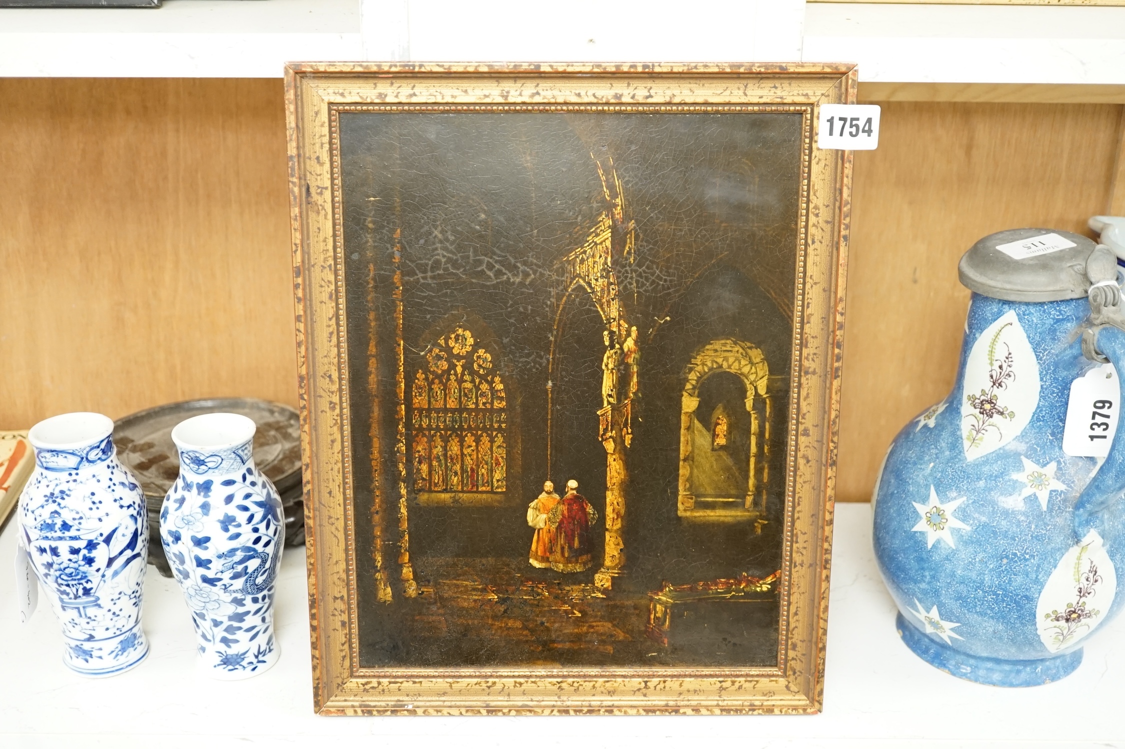 A mixed media and gilt panel, two figures in an ecclesiastical setting, 30 x 23cm. Condition - fair